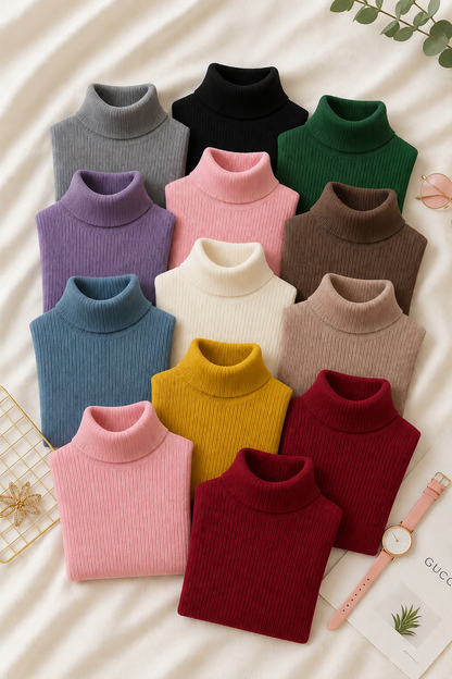 Twelve folded ribbed turtleneck sweaters in assorted colors arranged in a grid on a cream fabric background, with a watch and small decorative props nearby.